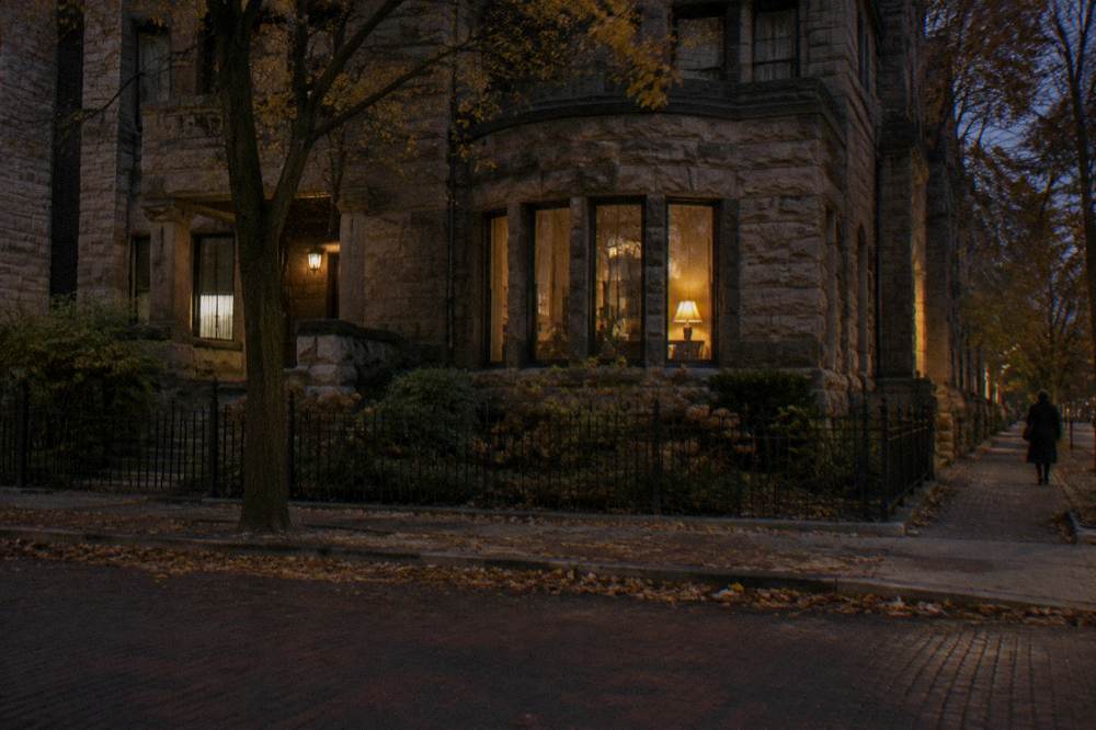 Historic Chicago buildings on Prairie Avenue at night with warm window light