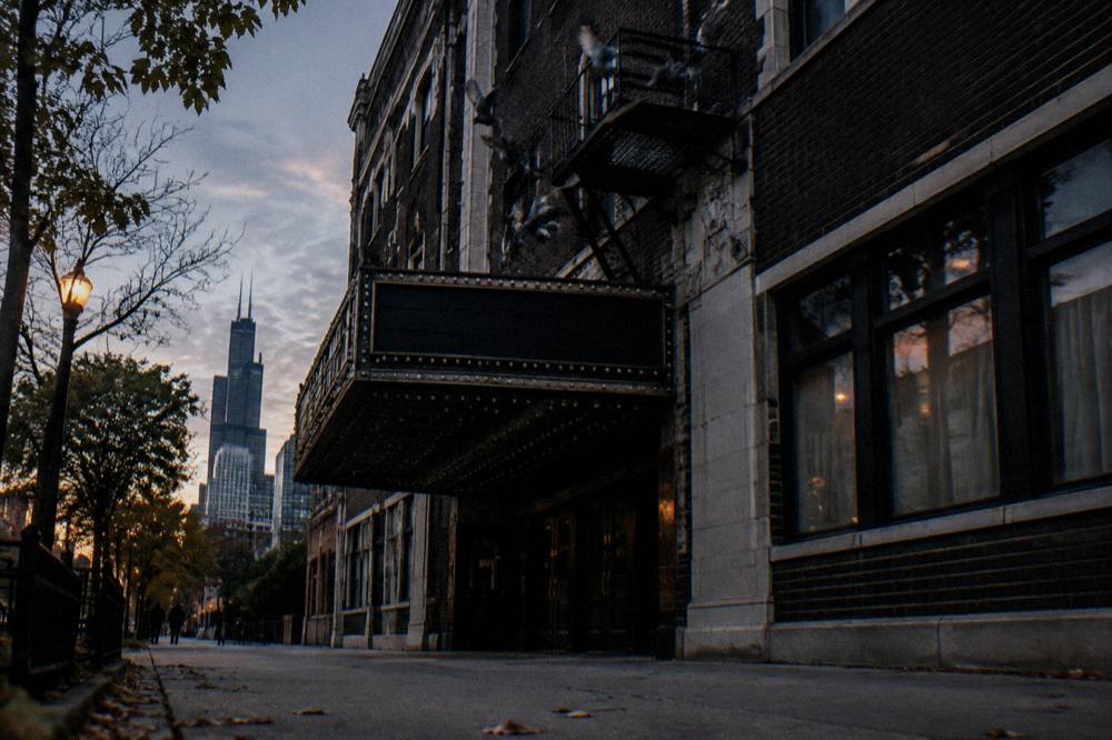 Vintage marquee and brick facade of a historic Uptown Chicago jazz cocktail lounge at dusk