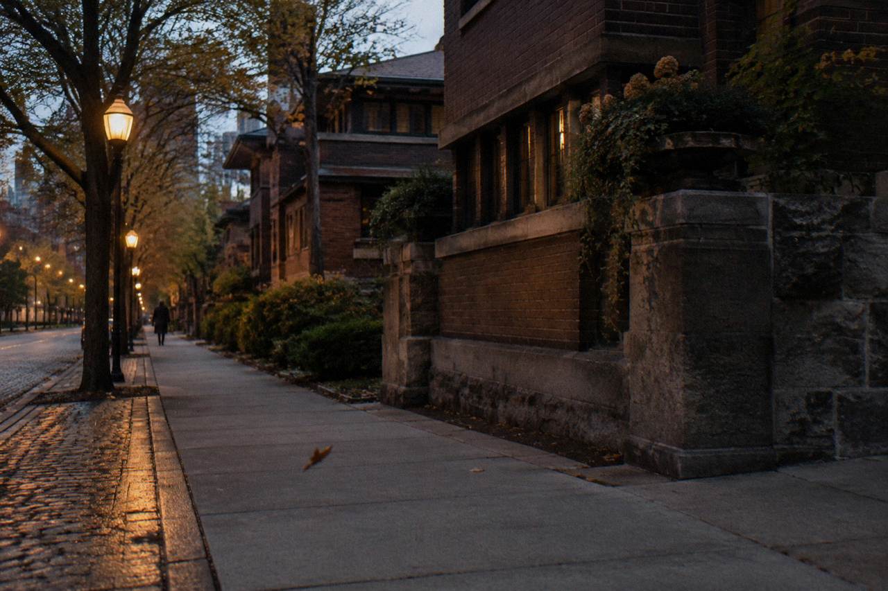 Empty Chicago street at dusk with vintage streetlights and old brick buildings