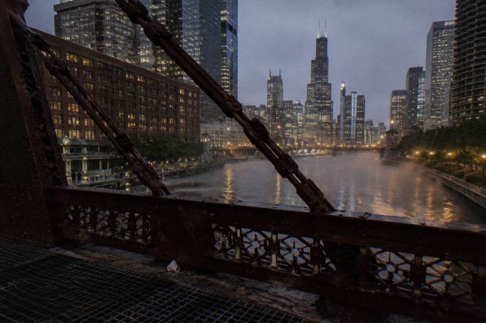 Illuminated Chicago skyline seen across the river at night
